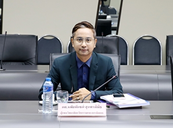chairing the meeting at the university
council room